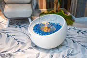Elementi Firenze bio-ethanol vuurschaal Cream White met blauwe glasdecoratie en vlam