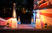 DolceVita Lightfire terrasverwarmer in een moderne tuinsetting bij avondlicht